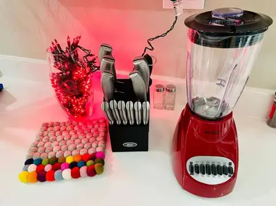 a blender sitting on a counter next to a bunch of balls at Artists Bungalow ARCADE King Beds near the beat in Sacramento