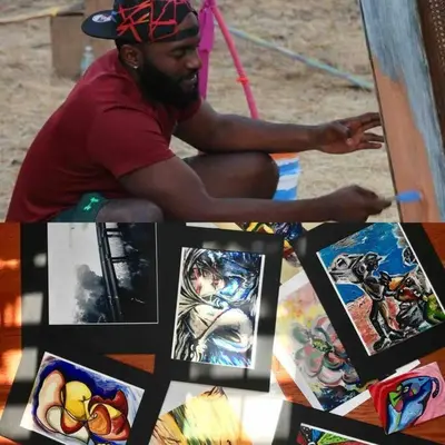 a man sitting in front of a table with pictures at Artists Bungalow ARCADE King Beds near the beat in Sacramento