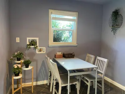a dining room with a table and chairs and a window at Sweet Home in Sacramento Only 2mins to Freeway in Sacramento