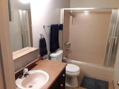 a bathroom with a sink and a toilet and a shower at Fairway Apartments Unit 1 in Twain Harte