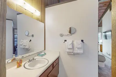 a bathroom with a sink and a mirror at Sierra Park Villas 39 H in Mammoth Lakes