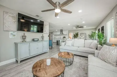 a living room with a couch and a table at Fun City Haven Spacious Retreat in Fresno in Fresno