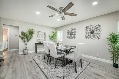 a dining room with a table and chairs at Fun City Haven Spacious Retreat in Fresno in Fresno