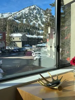 a window with a view of a snow covered mountain at Gondola Chalet -New Luxury 5 Bdrm Condo @ Canyon Lodge, Steam Room in Mammoth Lakes