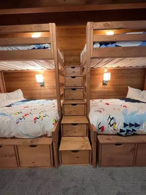 a bedroom with two bunk beds next to each other at Gondola Chalet -New Luxury 5 Bdrm Condo @ Canyon Lodge, Steam Room in Mammoth Lakes