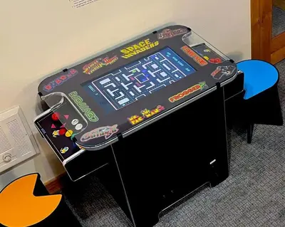 a video game machine sitting on top of a table at Gondola Chalet -New Luxury 5 Bdrm Condo @ Canyon Lodge, Steam Room in Mammoth Lakes