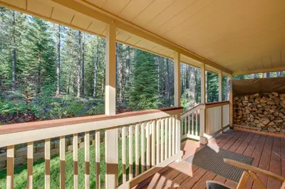 a screened porch with a view of the woods at Hike, Boat and Ski South Lake Tahoe Home in South Lake Tahoe