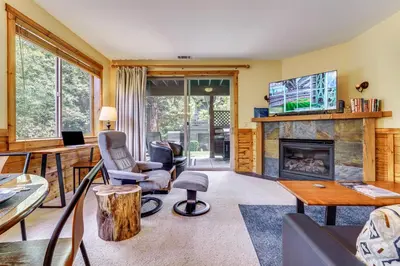 a living room filled with furniture and a fireplace at Boulders Truckee Condo Near Donner Lake and Skiing! in Truckee
