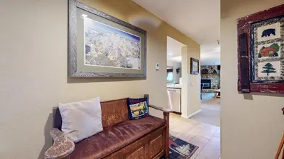 a living room with a brown leather couch at Bridges #108 condo in Mammoth Lakes