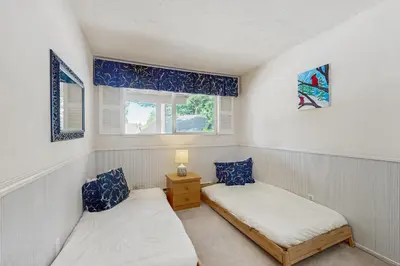 two twin beds in a room with a window at Mountain Shadows in Incline Village