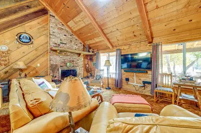 a living room with a couch and a tv at Countryside Views Family-Friendly Badger Cabin in Badger