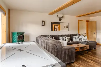 a living room with a couch and a table at The Modern Moose Lodge in Truckee