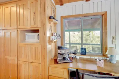 a kitchen with a counter with a sewing machine on a table at Scenic Kernville Getaway with Deck and Mountain Views! in Kernville