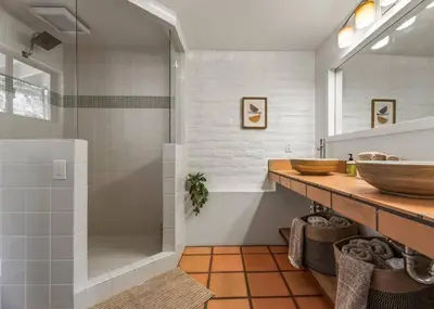 a bathroom with a shower and two sinks and a tub at Scenic Spanish Rancho - Breathtaking Views in Three Rivers