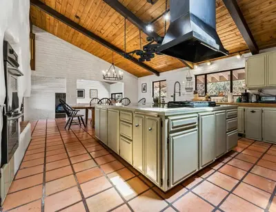 a large kitchen with stainless steel cabinets and a stove at Scenic Spanish Rancho - Breathtaking Views in Three Rivers