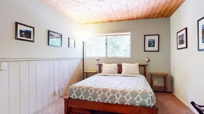 a bedroom with a bed and a window at La Residence V #T05 condo in Mammoth Lakes