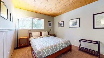 a bedroom with a bed and a window at La Residence V #T05 condo in Mammoth Lakes