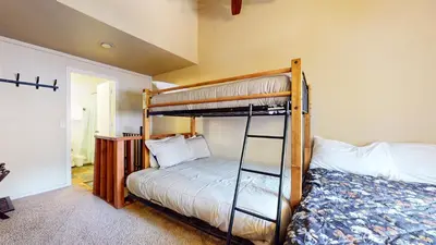 a bedroom with a bunk bed and a bunk bedouble at La Residence V #T05 condo in Mammoth Lakes