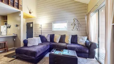 a living room with a couch and a table at La Residence V #T05 condo in Mammoth Lakes