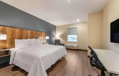 a hotel room with a large bed and a desk at Extended Stay America Premier Suites - Reno - Sparks in Sparks