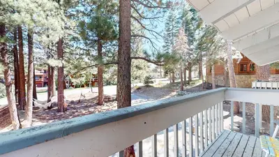 a view from the balcony of a house with trees at Lakeview Lodge #1 condo in Mammoth Lakes