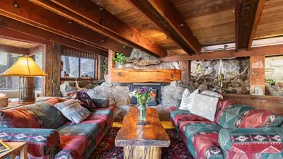 a living room with a couch and a table at Mt. Jola by AvantStay A 5-minute walk away to Palisades and lifts. in Olympic Valley