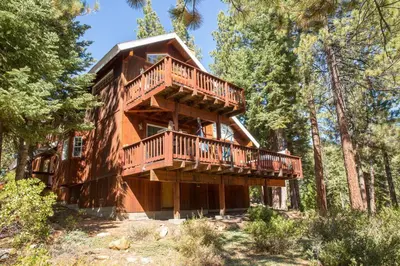 a tree house with a deck in the woods at Tahoe Vista Home w/ Spa close to Northstar & Lake in Tahoe Vista