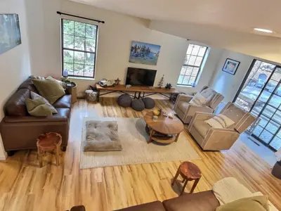 a living room with a couch and a table at Walking Distance To The Lake And Beach! in Kings Beach
