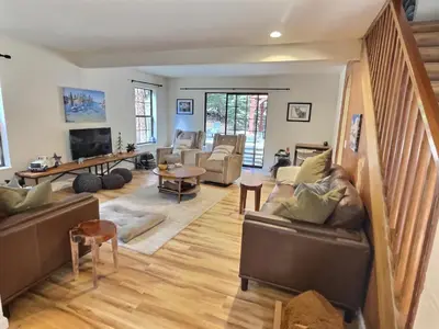 a living room with couches and a tv at Walking Distance To The Lake And Beach! in Kings Beach