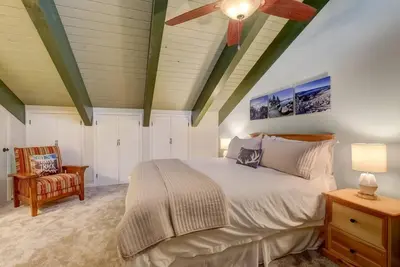 a bedroom with a bed and a ceiling fan at Tahoe Snowbird Retreat in Stateline
