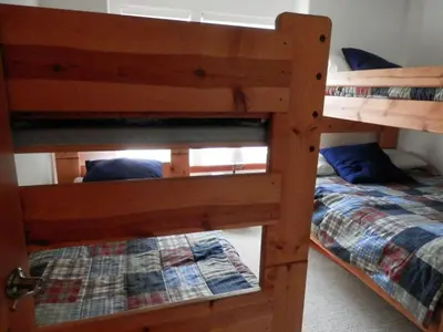 two bunk beds in a room with a bed at Rr-hideaway_down_canyon110 in June Lake