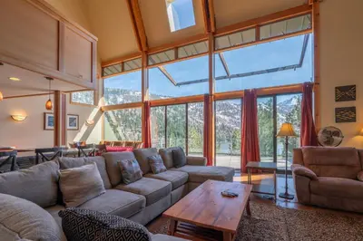 a living room with a couch and a table at Rr-carson_view1 Strap18-005 in June Lake