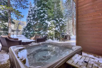 a jacuzzi tub in the snow in a yard at Palisades Tahoe Mountain Oasis in Olympic Valley