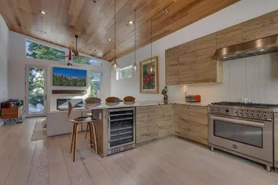 a large kitchen with a stove and a counter top at Palisades Tahoe Mountain Oasis in Olympic Valley