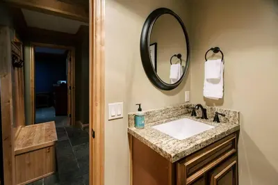 a bathroom with a sink and a mirror at BEST Location . Walk To Canyon Lodge . Views . Pool/Spa in Mammoth Lakes