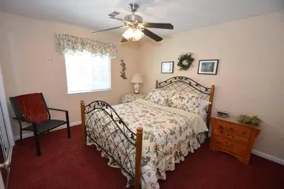 a bedroom with a bed and a ceiling fan at Forward-Lake Area in Bass Lake