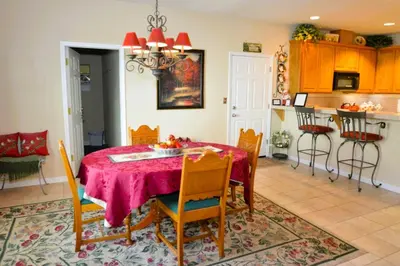a kitchen and dining room with a table and chairs at Forward-Lake Area in Bass Lake