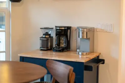 a counter top with a coffee maker and a coffee maker at Lupine Landing in Mariposa
