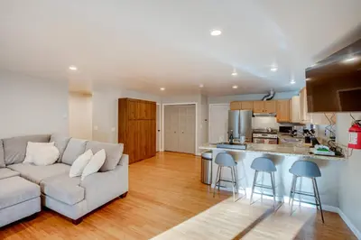 a living room with a couch and a kitchen at Ski and Board in South Lake Tahoe! Updated Home in South Lake Tahoe