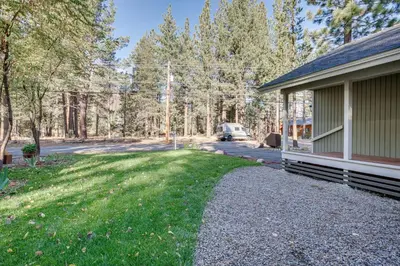 a house with a car parked next to a yard at Ski and Board in South Lake Tahoe! Updated Home in South Lake Tahoe