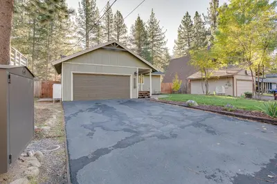 a driveway with a garage in front of a house at Ski and Board in South Lake Tahoe! Updated Home in South Lake Tahoe