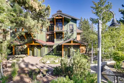 a house in the woods with a street light at Mammoth Lakes Condo with Fireplace Near Skiing! in Mammoth Lakes