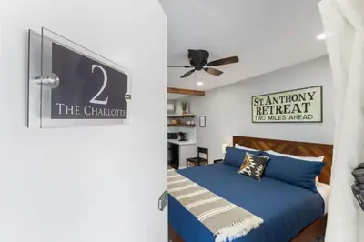 a bedroom with a blue bed and a ceiling fan at The Charlotte Sequoia Motel R2 in Three Rivers