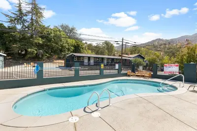 a small swimming pool in the middle of a yard at The Moro | Sequoia Motel RM3 in Three Rivers
