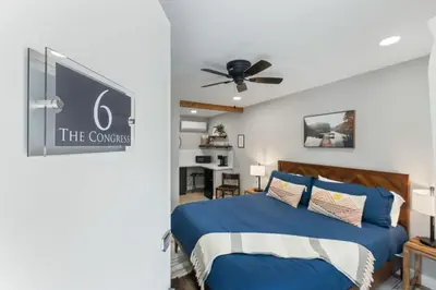 a bedroom with a bed and a ceiling fan at The Congress Sequoia Motel RM6 in Three Rivers