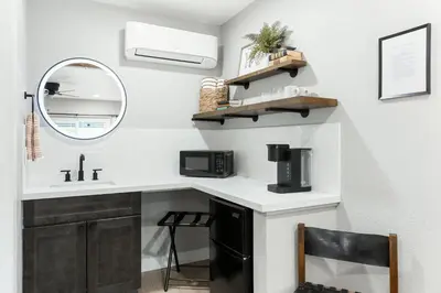 a kitchen with a sink and a microwave at The Congress Sequoia Motel RM6 in Three Rivers