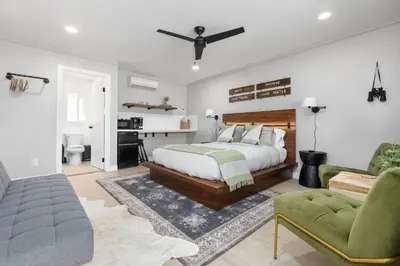 a bedroom with a bed and a desk and a couch at The Atwell Sequoia Motel RM 8 in Three Rivers