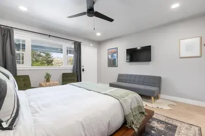 a bedroom with a bed and a tv and a couch at The Atwell Sequoia Motel RM 8 in Three Rivers