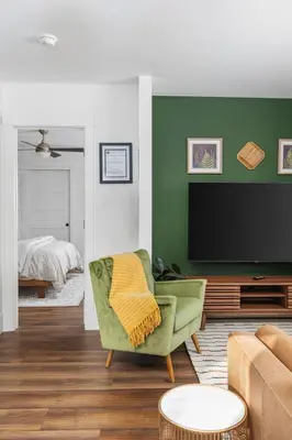 a living room with a couch and a tv at Manzanita Rest in Mariposa