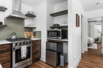 a kitchen with a stove and a microwave at Manzanita Rest in Mariposa
